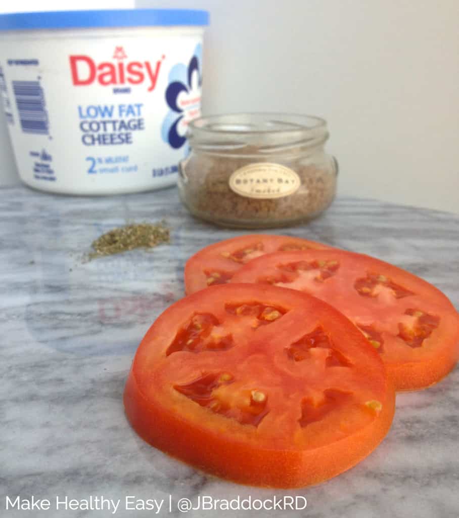 Smoky tomato with cottage cheese and a jar of Herbs de Provence seasoning