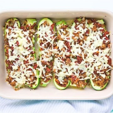 Sausage & Quinoa Stuffed Zucchini: Sun-dried tomatoes, lean sausage and Cabot cheddar jazz up the quinoa based filling for this delicious stuffed zucchini dish. It will have even quinoa-haters thinking twice. #MakeHealthyEasy