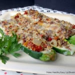 Cheddar & Quinoa Stuffed Zucchini: Sun-dried tomatoes, lean sausage and Cabot cheddar jazz up the quinoa based filling for this delicious stuffed zucchini dish. It will have even quinoa-haters thinking twice. #MakeHealthyEasy blog by @JBraddockRD