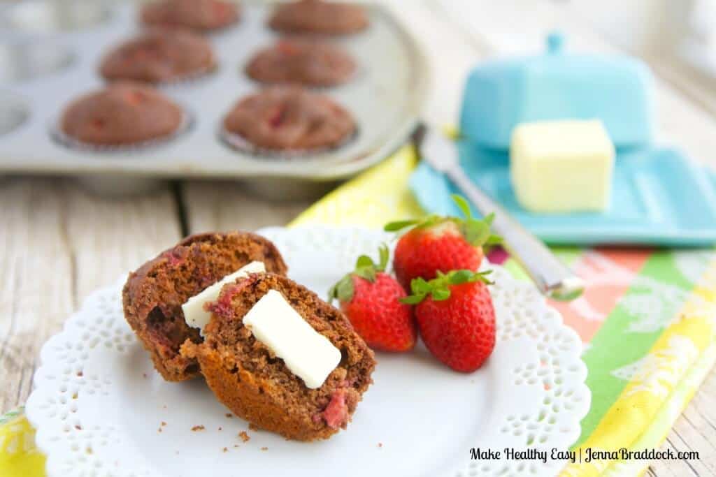 chocolate strawberry breakfast muffin cut in half with a pat of butter