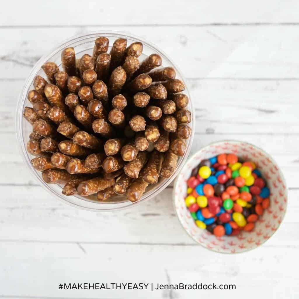 These White Chocolate Dipped Pretzel Rods are so easy that you will never need to buy a sweet treat for a party or special gift again. Serve them open in a mason jar or individually wrapped for a reasonable, beautiful dessert. #MakeHealthyEasy via @JBraddockRD http://JennaBraddock.com