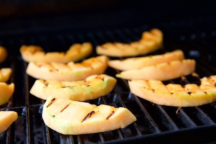 A tutorial on how to slice and grill cantaloupe that finishes with the recipe for Grilled Cantaloupe Salad with Blueberry Ginger Vinaigrette. #MakeHealthyEasy via @JBraddockRD https://jennabraddock.com