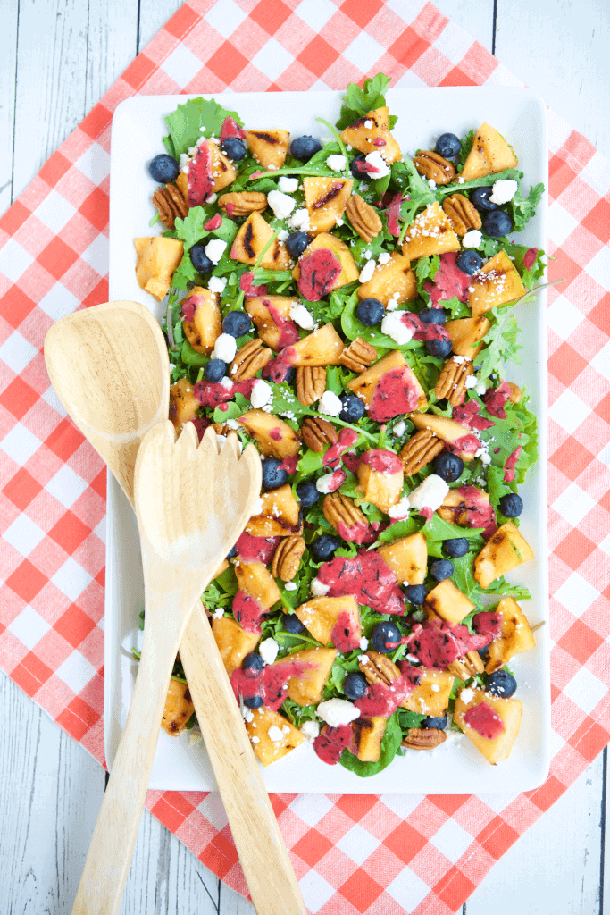A tutorial on how to slice and grill cantaloupe that finishes with the recipe for Grilled Cantaloupe Salad with Blueberry Ginger Vinaigrette. #MakeHealthyEasy via @JBraddockRD https://jennabraddock.com
