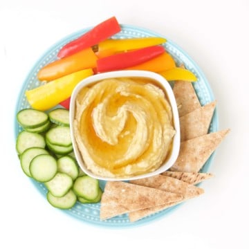 Take hummus up a notch with this fancy, but simple, honey drizzled roasted garlic hummus recipe.