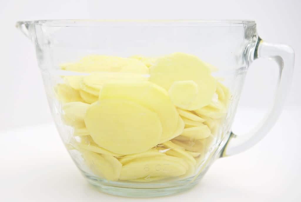 potatoes sliced thin and placed in a bowl