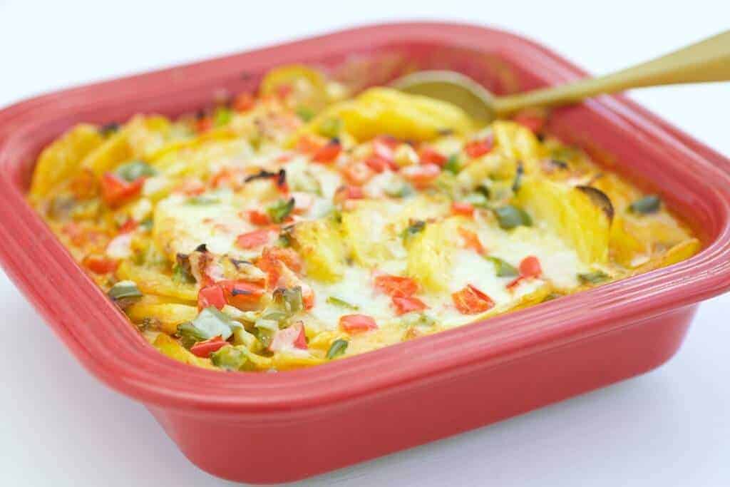 lightened up pesto potato gratin in a dish