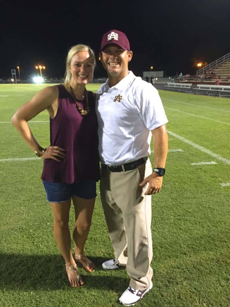 Jenna and Coach on the football field