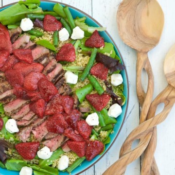 This unique salad pairs bold-flavored steak with the naturally sweet, roasted strawberries to create a surprising combinations. Layering a lean steak on top of a mound of nutrient rich ingredients is a balanced way to enjoy it any day of year.
