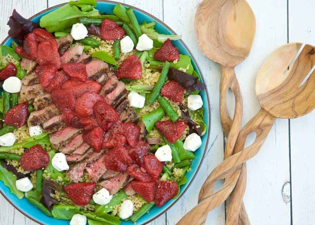 This unique salad pairs bold-flavored steak with the naturally sweet, roasted strawberries to create a surprising combinations. Layering a lean steak on top of a mound of nutrient rich ingredients is a balanced way to enjoy it any day of year.