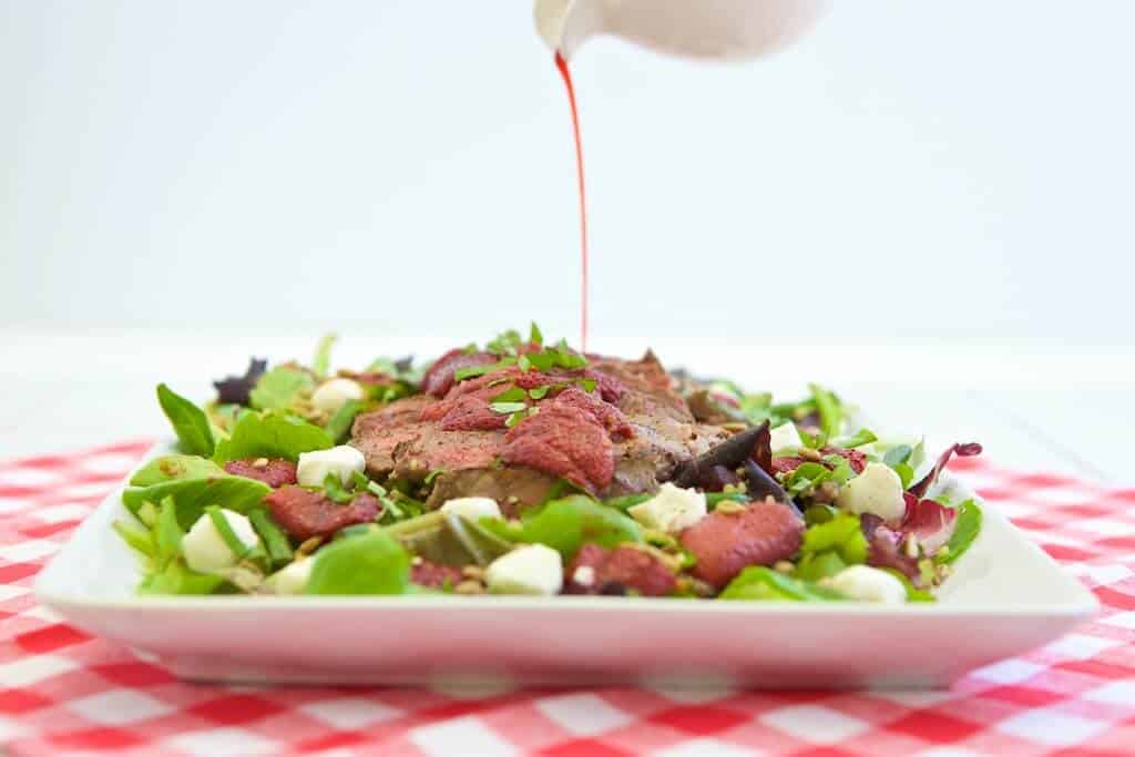 This unique salad pairs bold-flavored steak with the naturally sweet, roasted strawberries to create a surprising combinations. Layering a lean steak on top of a mound of nutrient rich ingredients is a balanced way to enjoy it any day of year.