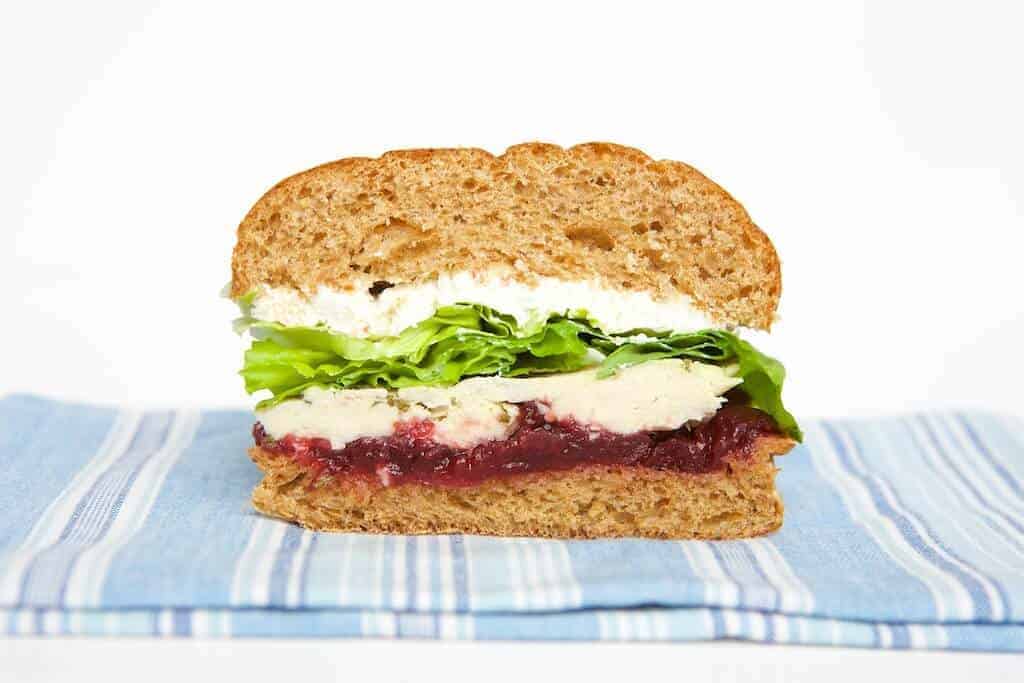 turkey cranberry sandwich sliced in half