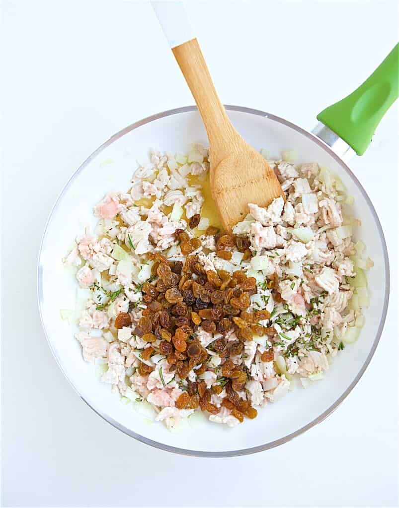 stirring ingredients together in a bowl with a wooden spoon