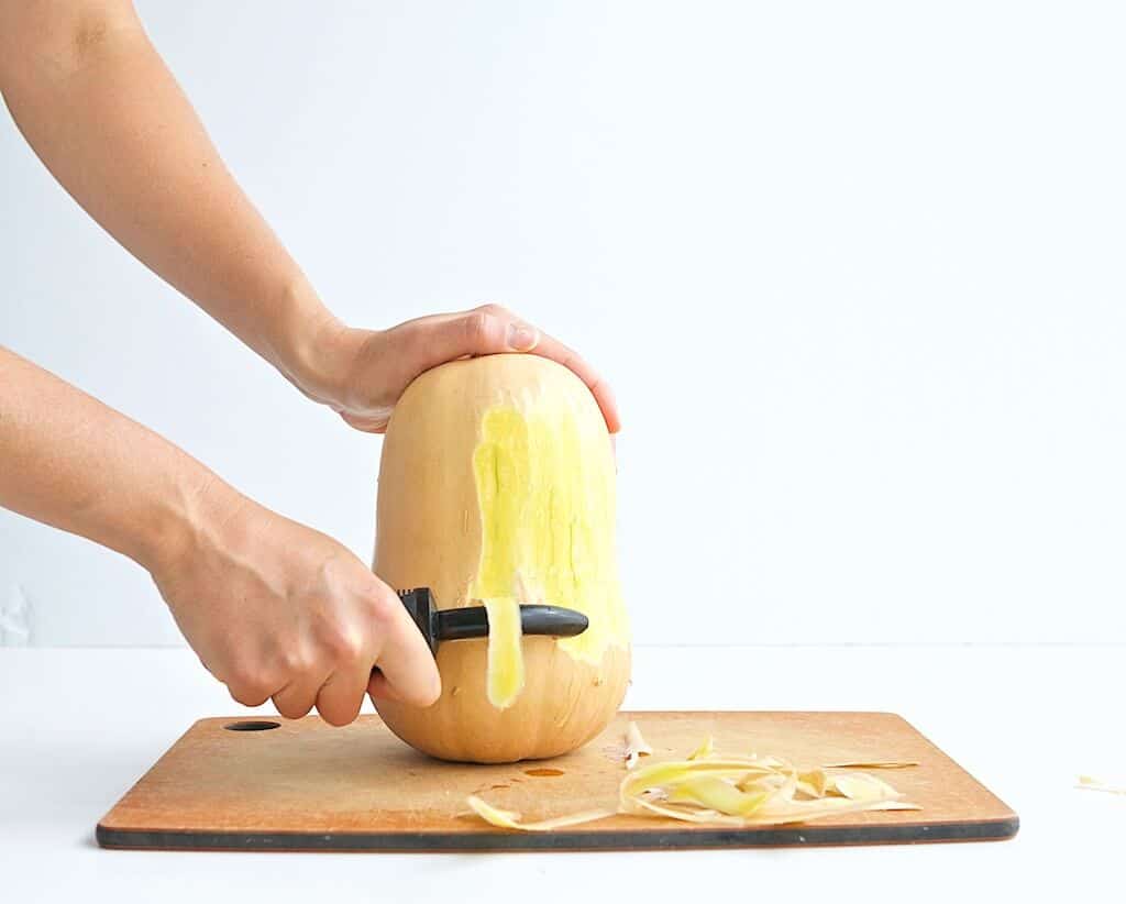 peeling butternut squash