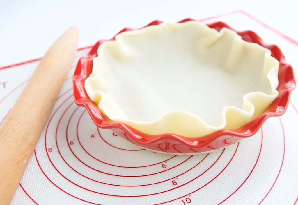 Pie dough rolled into pie dish.