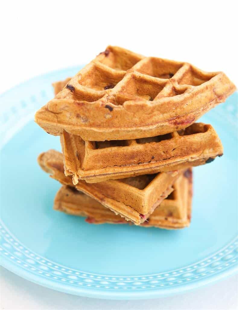 Whole grain strawberry waffles on a plate.