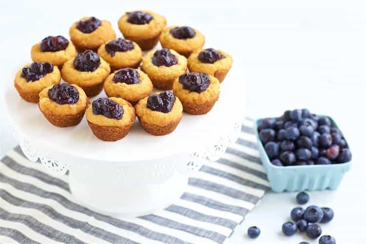 Boozy Blueberry Bacon Bites on a cake stand