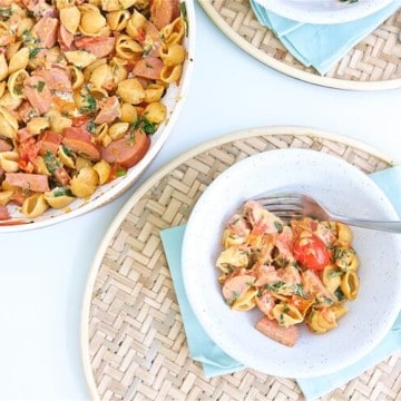 Creamy Tomato Kielbasa Pasta is a quick and balanced dinner recipe perfect for busy weeknights. This could become your family's next favorite meal.  