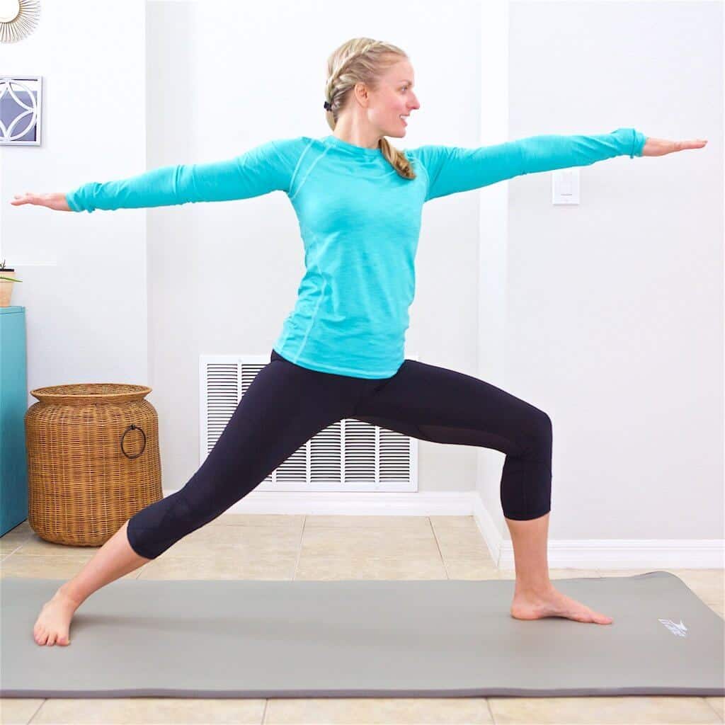 woman doing yoga pose during home workout schedule
