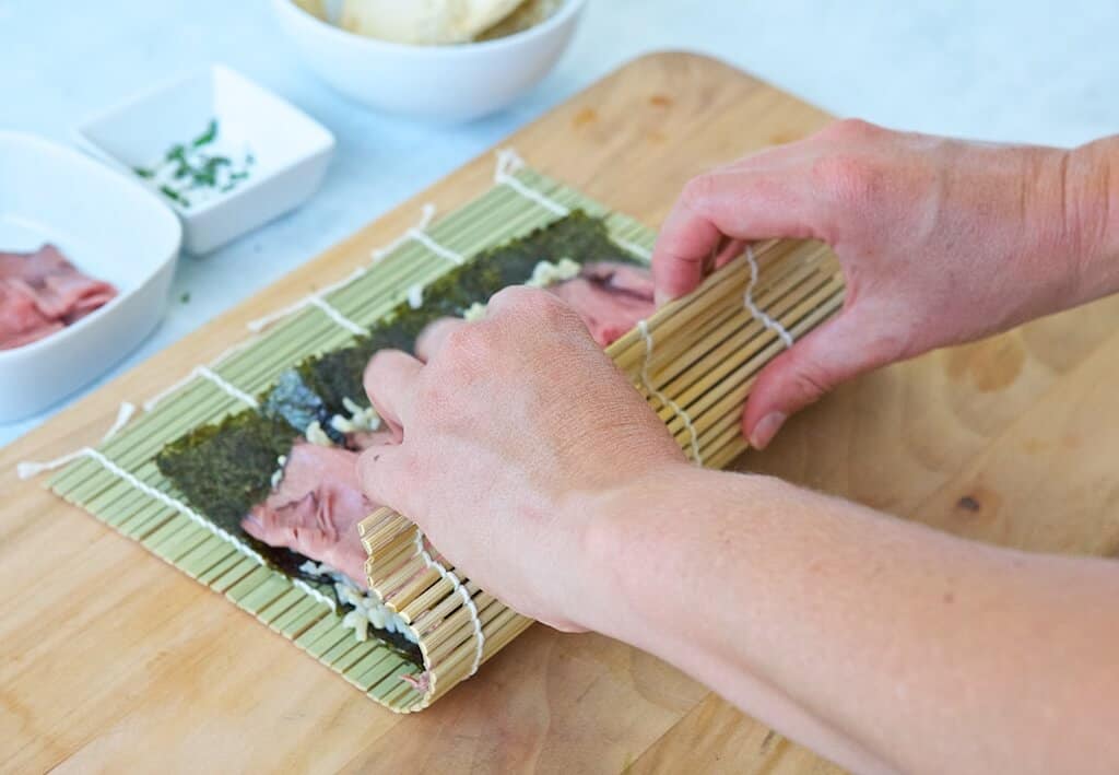 Rolling a sushi roll