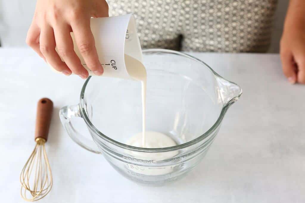 Pouring buttermilk into bowl