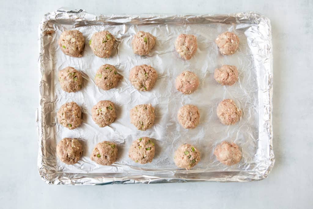 buffalo turkey meatballs on baking sheet