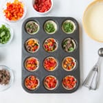 Filling muffin tins with veggies - Sausage mini breakfast pies