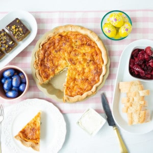 Easter brunch ideas - Overhead shot of quiche, berry compote and pistachio blonde brownies on table.