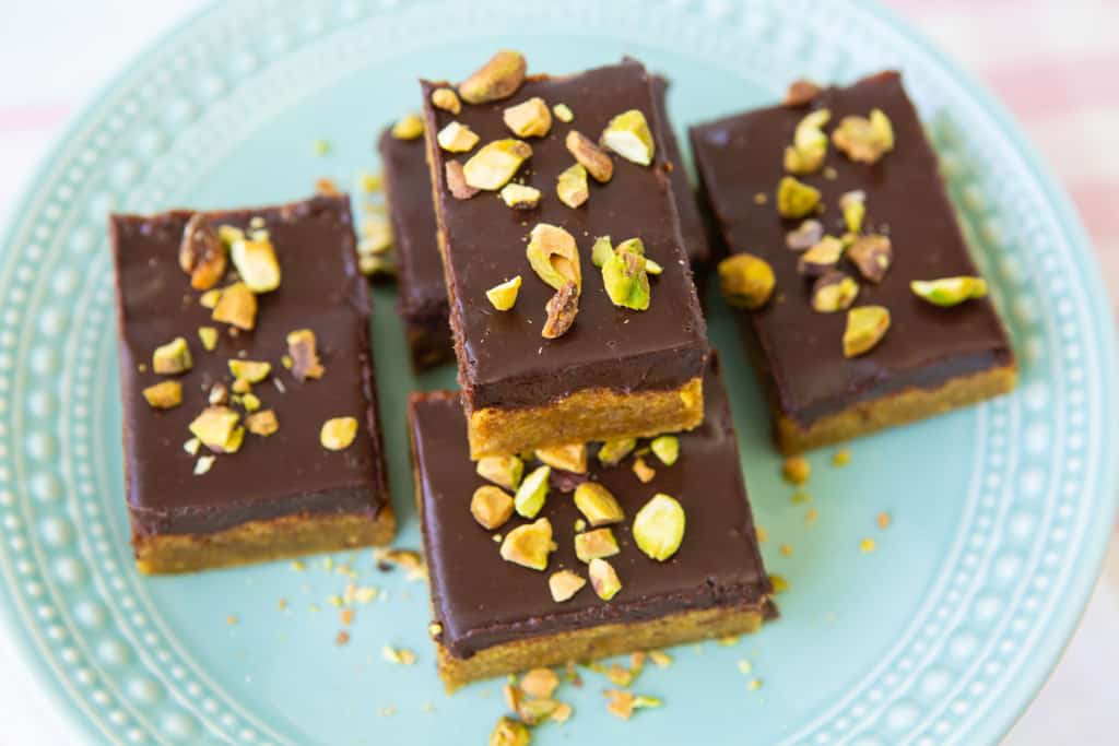 Pistachio blonde brownie bars on plate