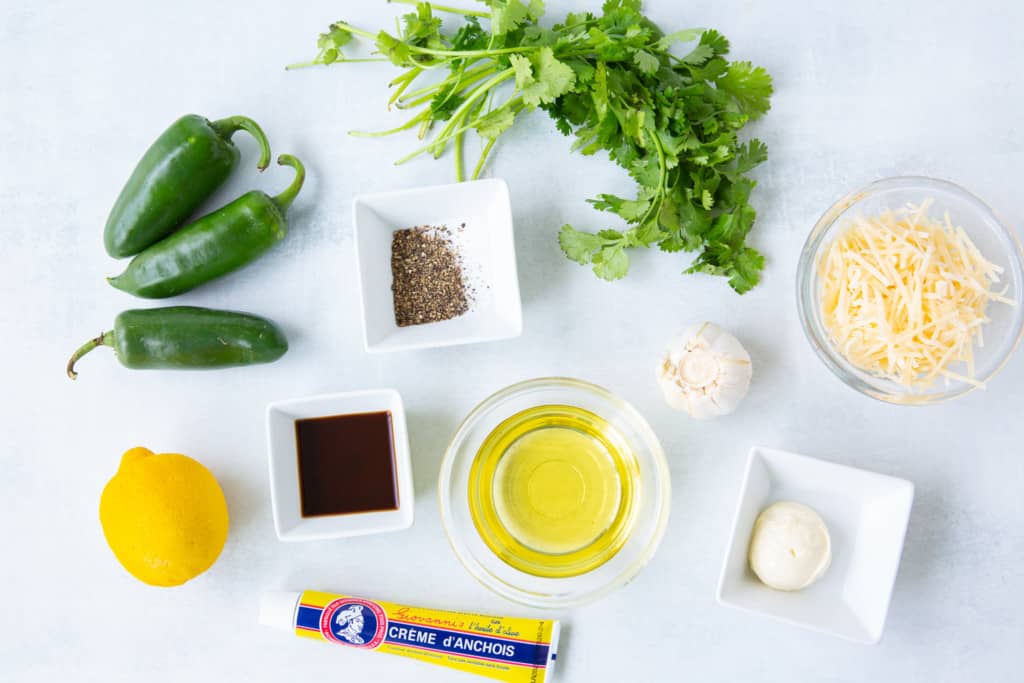 overhead shot of the ingredients for Jalapeno Cilantro Caesar Dressing 