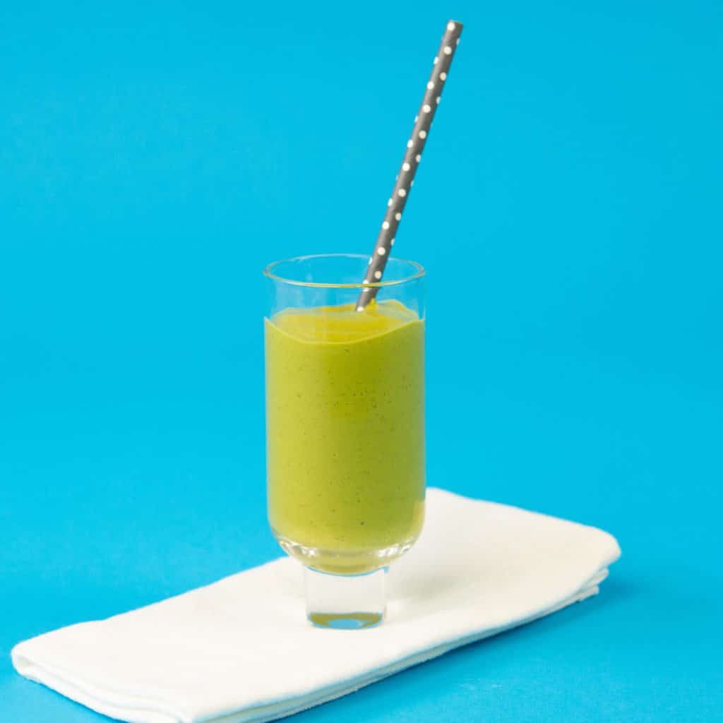 Kid Friendly Green Smoothie in glass with straw