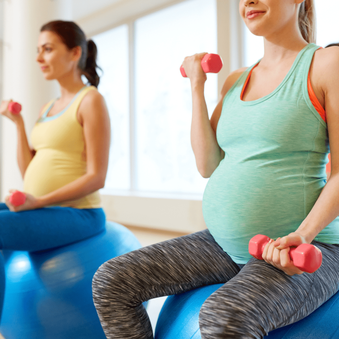 pregnant women exercising by doing bicep curls