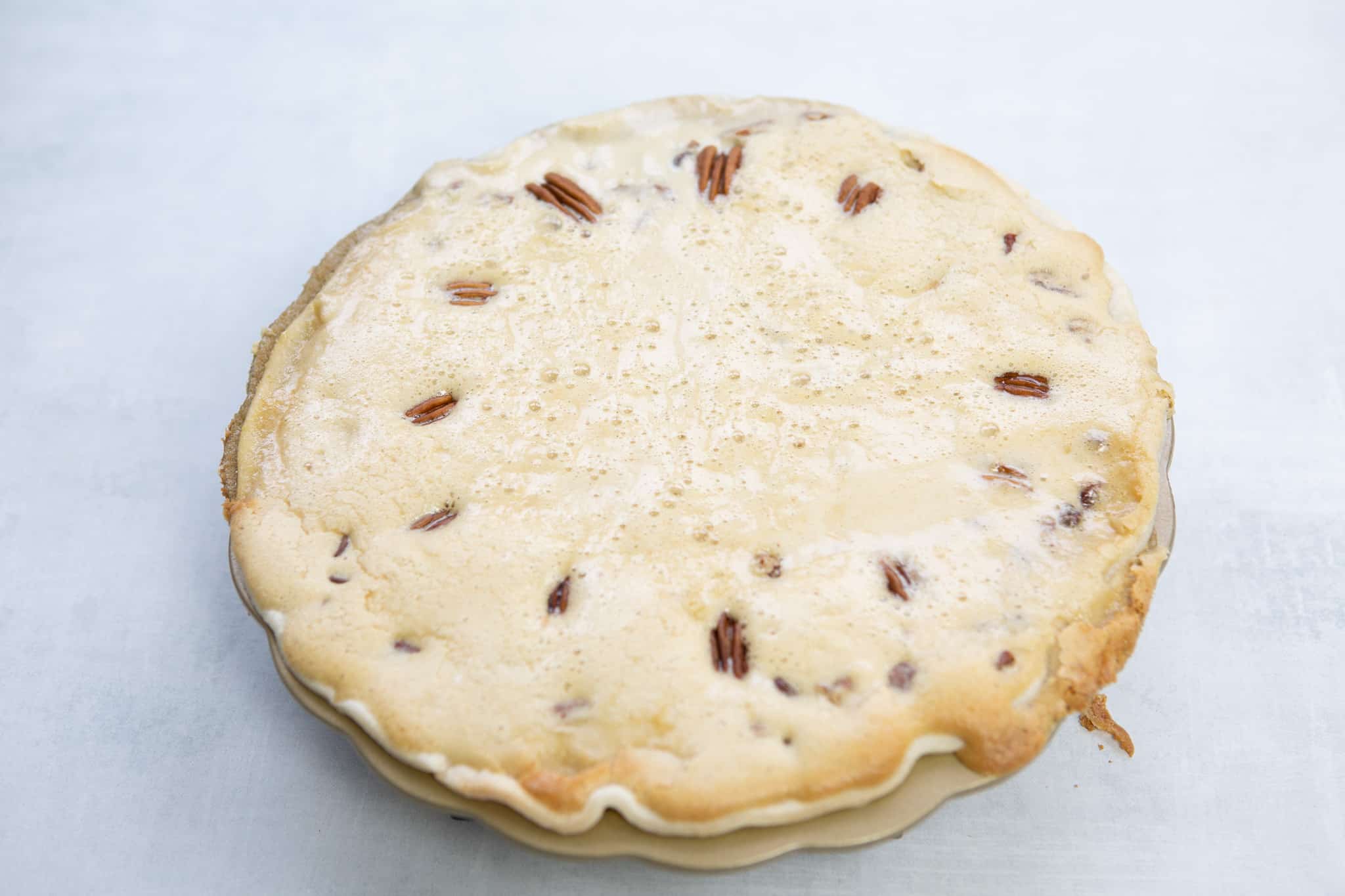 Pie with aluminum foil taken off, at the halfway point of baking.