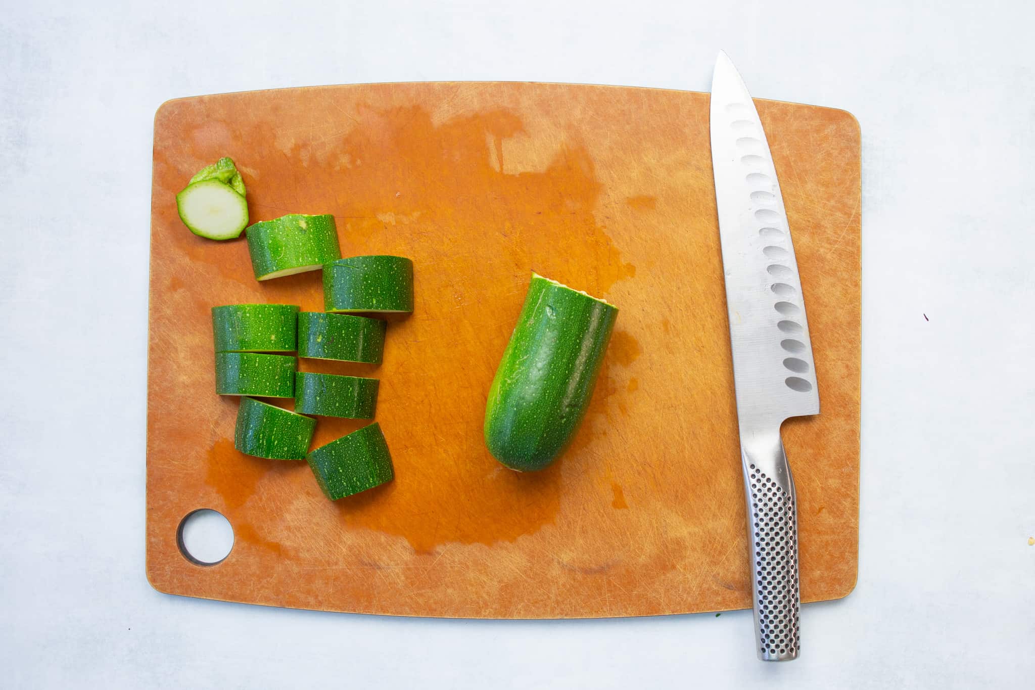 start with the zucchini and cut off the stem end