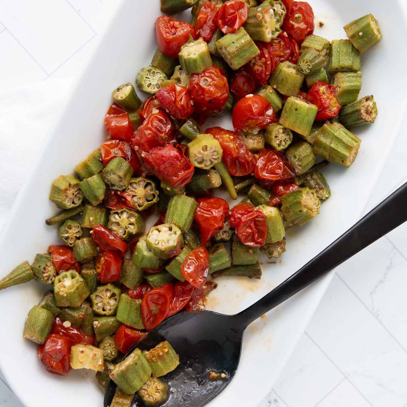 roasted okra and tomatoes in a serving dish