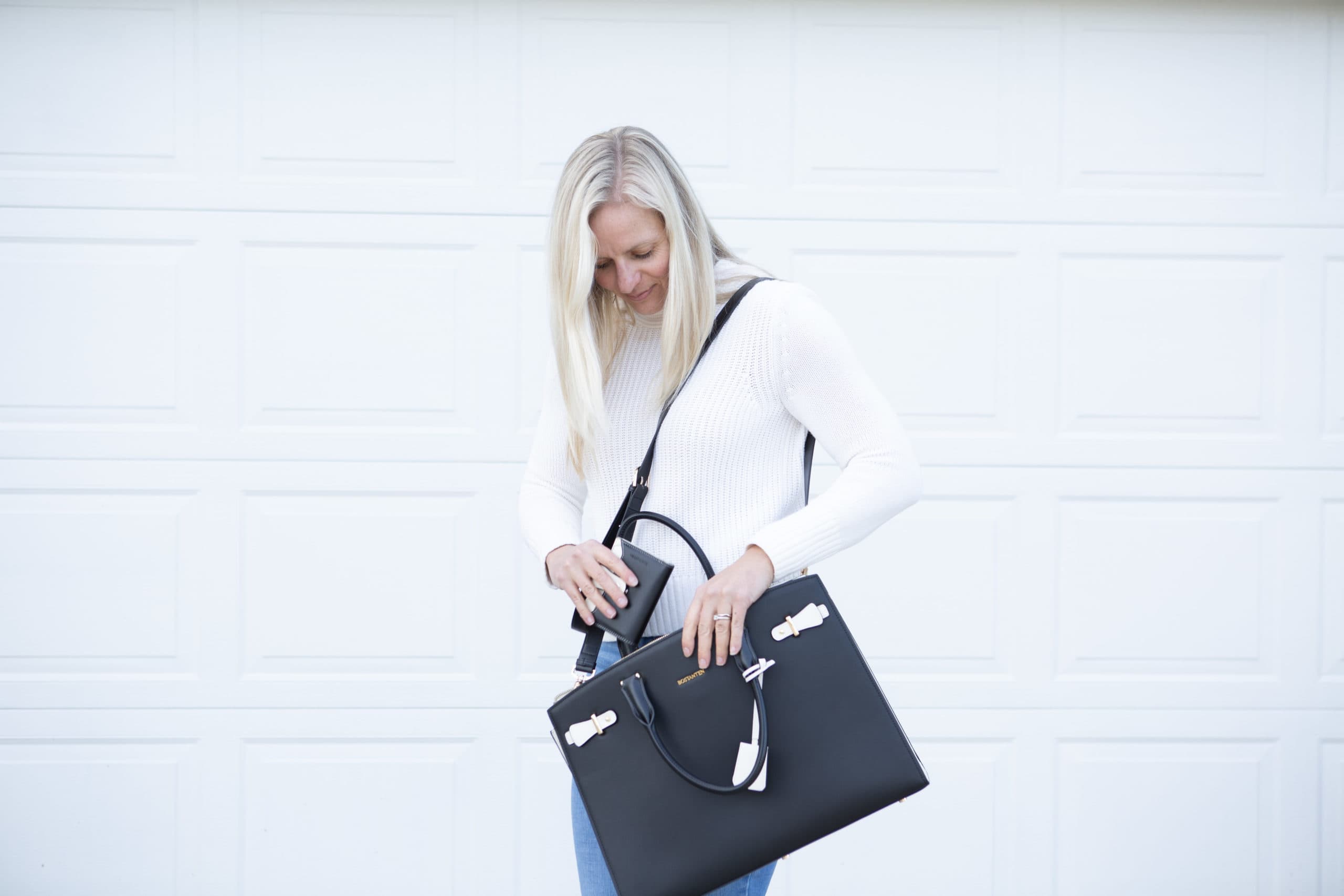 Jenna with a Bostanten wallet and briefcase from the Valentine gift guide
