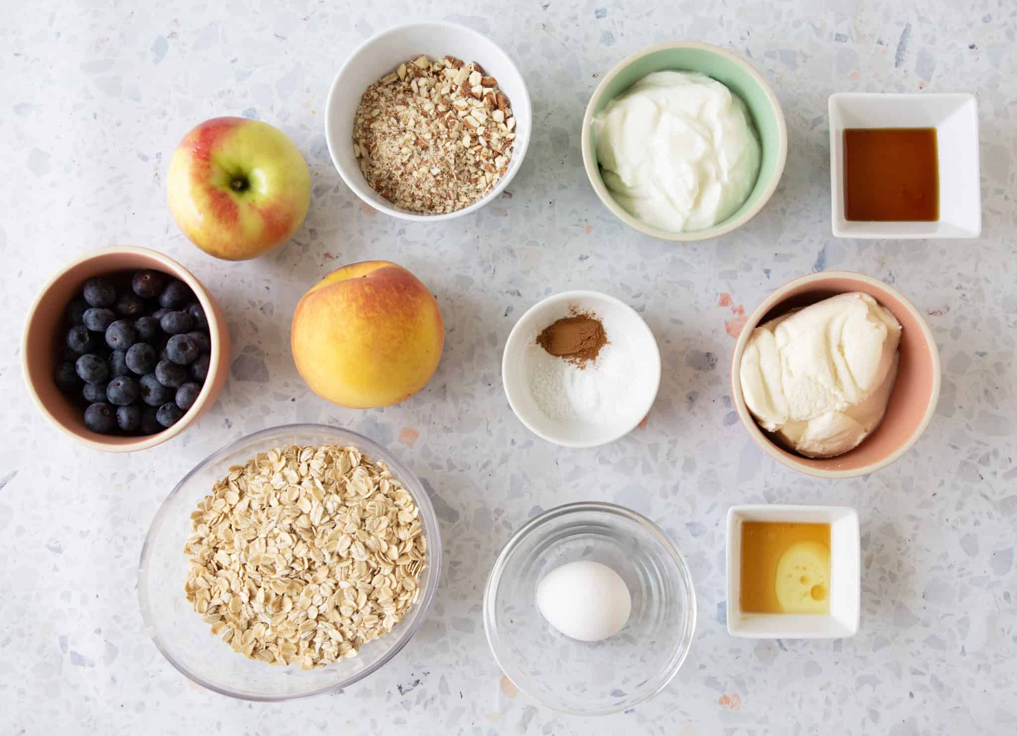 overhead shot of all ingredients for Oatmeal Griddle Cakes with Whipped Honey Ricotta topping.