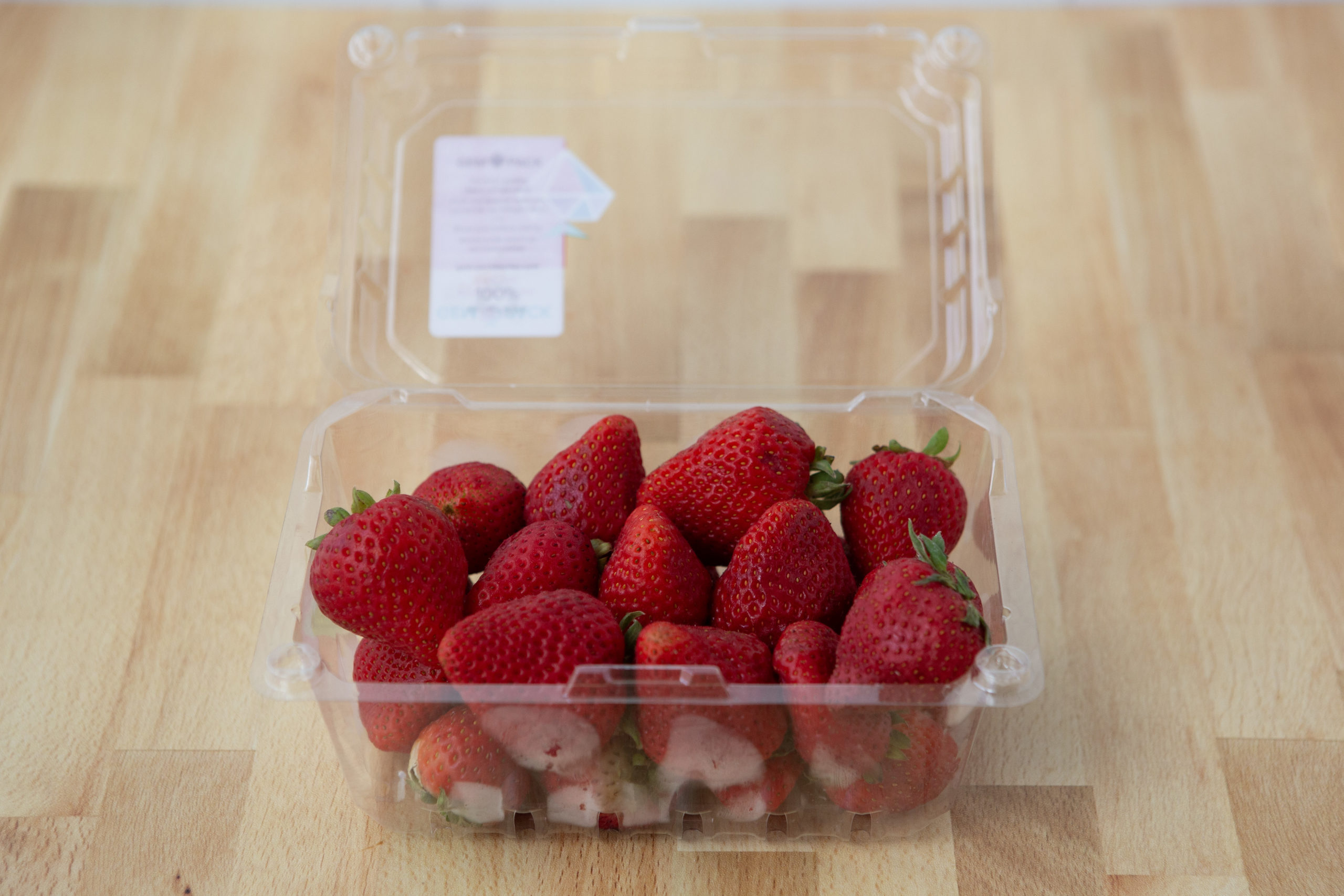 strawberries in plastic container