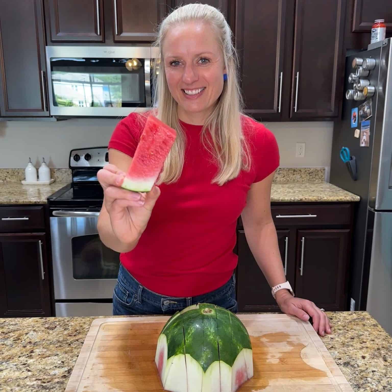 Jenna Braddock, RD holding a watermelon stick