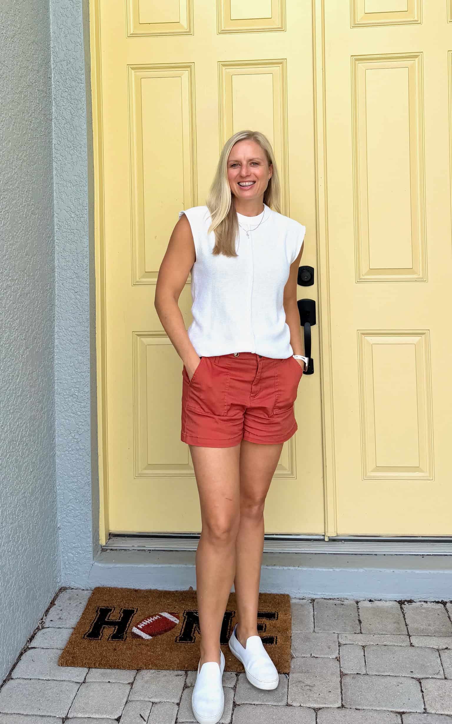 Jenna wearing red shorts and a white top from Stitch Fix